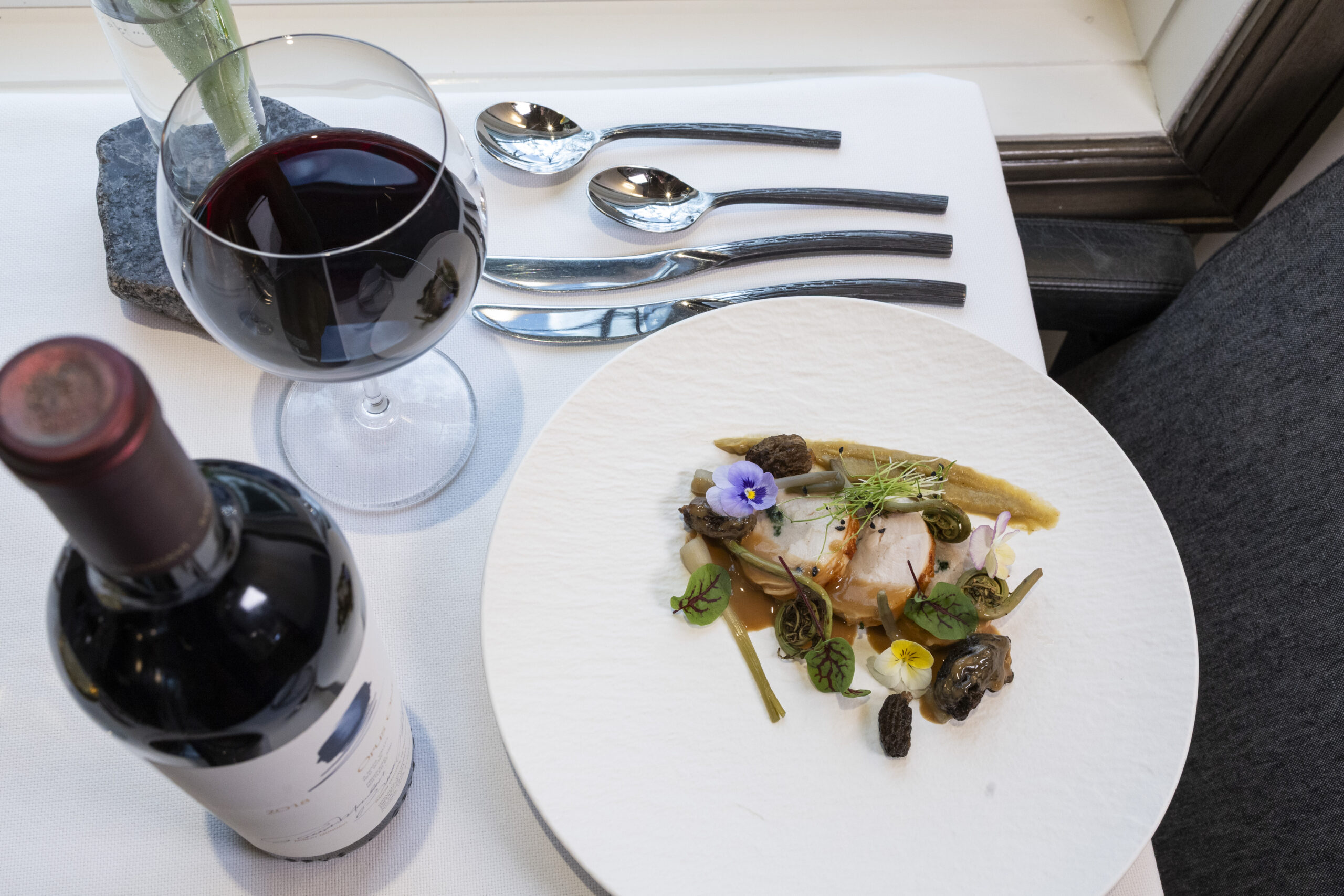 A plated tasting-menu course at Opus