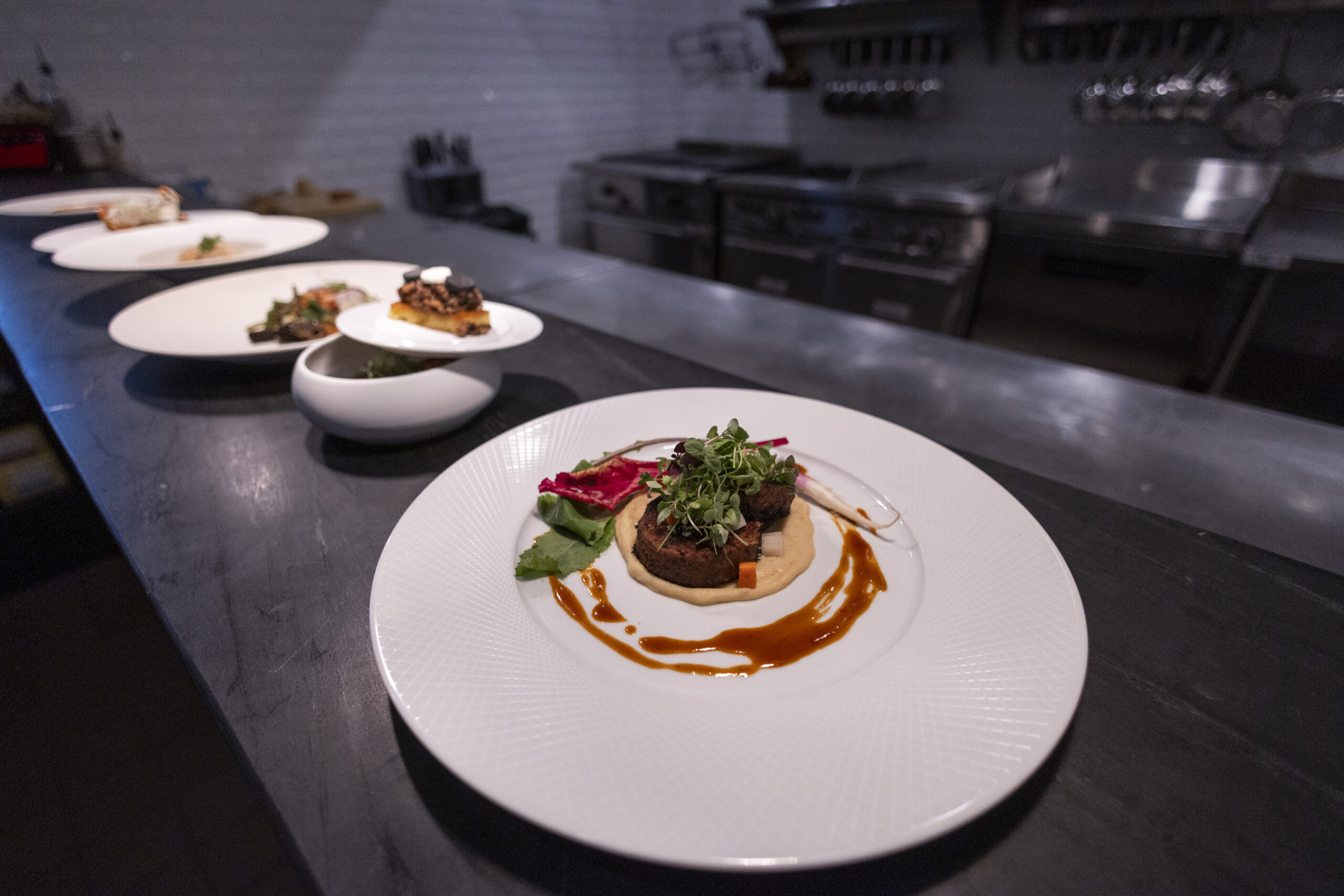 A course being prepared in the open kitchen